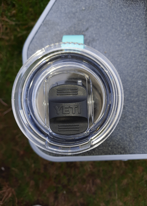 Yeti Rambler sitting in a cup holder on Coleman Deckchair 