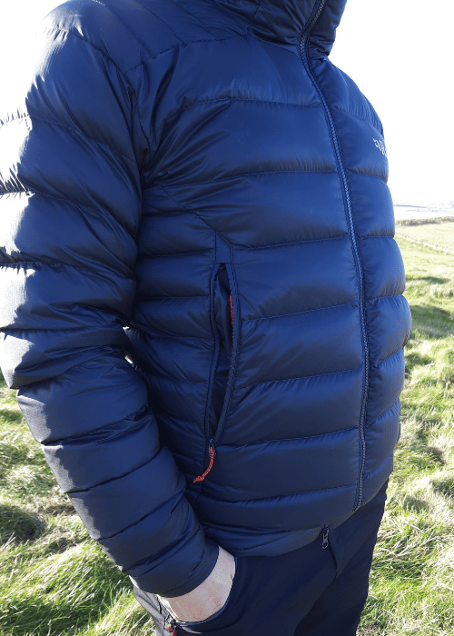 Large and deep handwarmer side pockets which are harness compatible for climbers