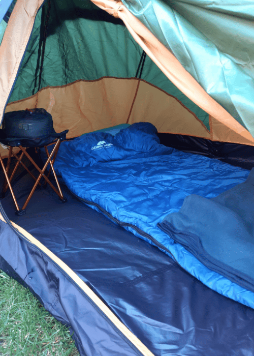 Using a camping blanket or quilt is a great additional layer of warmth
